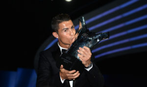 MONACO - AUGUST 28 :  Real Madrid Portuguese forward Cristiano Ronaldo poses with the UEFA's Best Player in Europe trophy during the UEFA Champions League draw, at the Grimaldi Forum, in Monaco on August 28, 2014. (Photo by Mustafa Yalcin/Anadolu Agency/Getty Images)